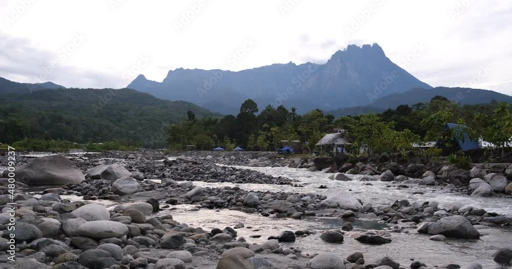 The Nohutu Eco Tourism campsite in the Kota Belud district is one of Sabah’s most picturesque.Resting on the banks of the Panataran River, with mount kinabalu as background The Nohutu Eco Tourism campsite in the Kota Belud district is one of Sabah’s most picturesque.Resting on the banks of the Panataran River, with mount kinabalu as background