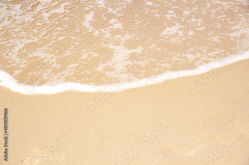 beautiful texture of sandy beach, white sea foam, building sand castles, summer vacation, fun on the beach, background for designer
