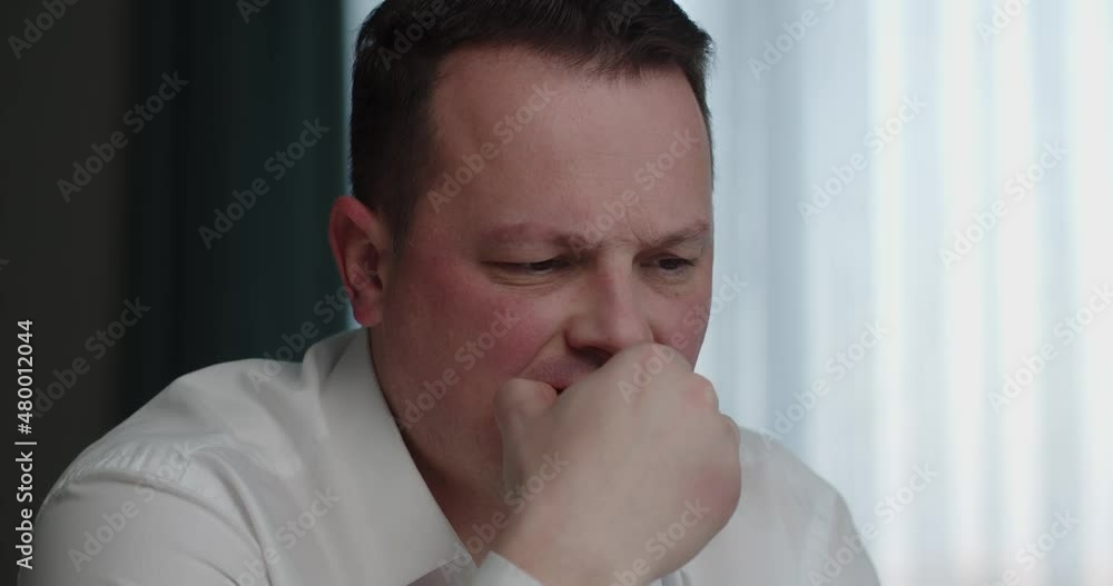 Man working on laptop and eating sandwich sitting at home. work online. Man working on laptop and eating sandwich sitting at home. work online.