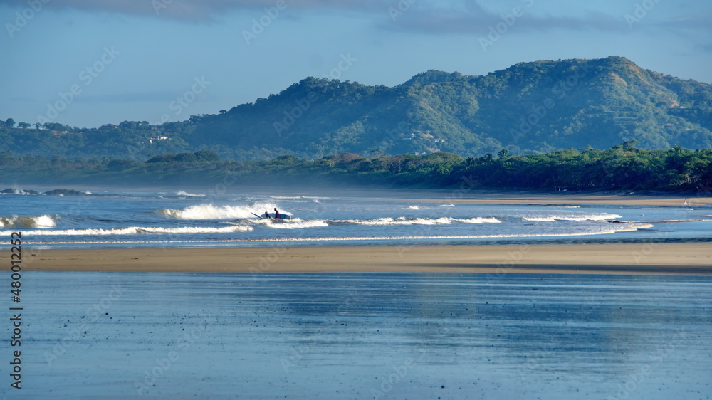 Landscape with a beach in front of the mountains in Tamarindo, Costa Rica