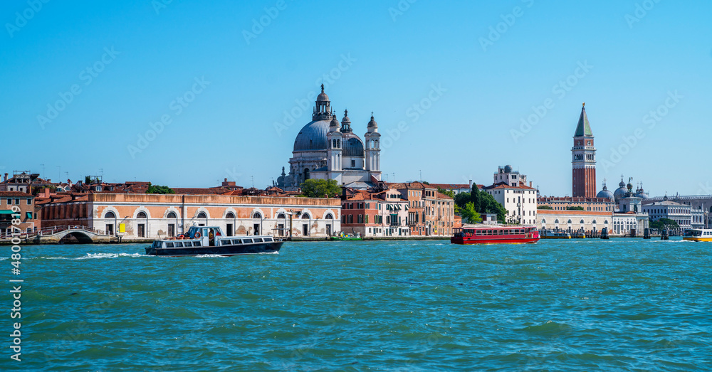 View of the Grand Canal and Santa Maria della Salute church in Venice, Italy. The Grand Canal is the most important water way of Venice. Vintage tone filter effect with noise and grain.