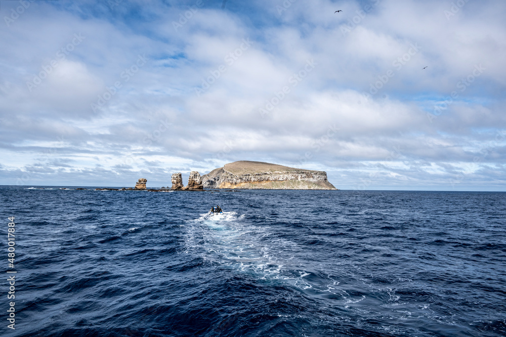 uninhabited islands of the Galapagos archipelago against the backdrop of the sea and blue sky uninhabited islands of the Galapagos archipelago against the backdrop of the sea and blue sky