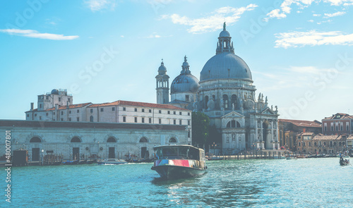 View of the Grand Canal and Santa Maria della Salute church in Venice, Italy. The Grand Canal is the most important water way of Venice. Architecture and landmarks.