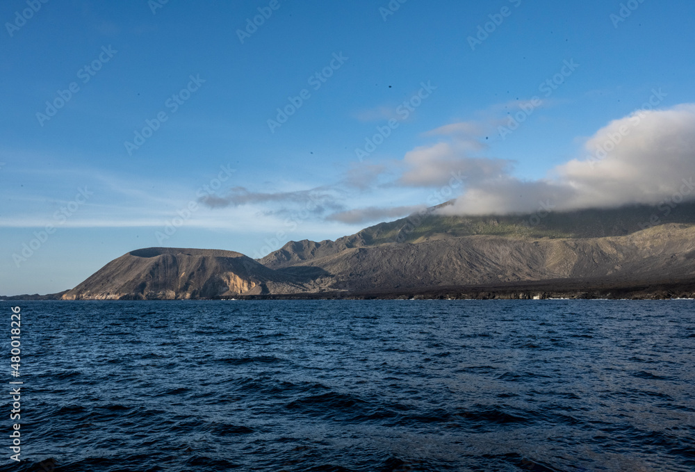 uninhabited islands of the Galapagos archipelago against the backdrop of the sea and blue sky uninhabited islands of the Galapagos archipelago against the backdrop of the sea and blue sky