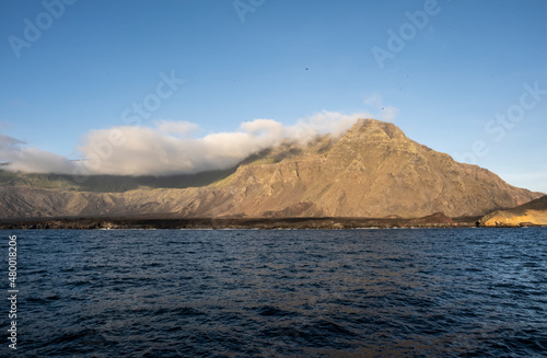 uninhabited islands of the Galapagos archipelago against the backdrop of the sea and blue sky 