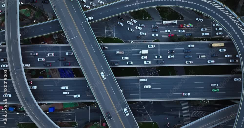 Aerial top view time lapse of traffic on the flyover overpass Cars driving on the road at Chengdu China busy highway at evening Aerial top view time lapse of traffic on the flyover overpass Cars driving on the road at Chengdu China busy highway at evening