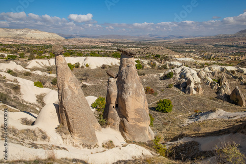 Three graces or three beauties fairy chimneys in Cappadocia, Turkey. Three graces are one of the most popular places for tourists in Cappadocia.