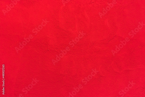 Red painted concrete wall surface texture abstract background