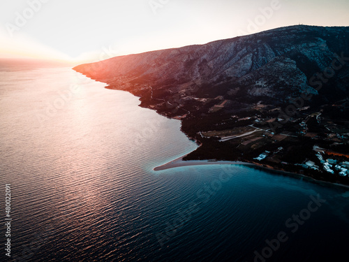 Zlatni rat beach in Bol at sunset, Island Brac, Croatia photo