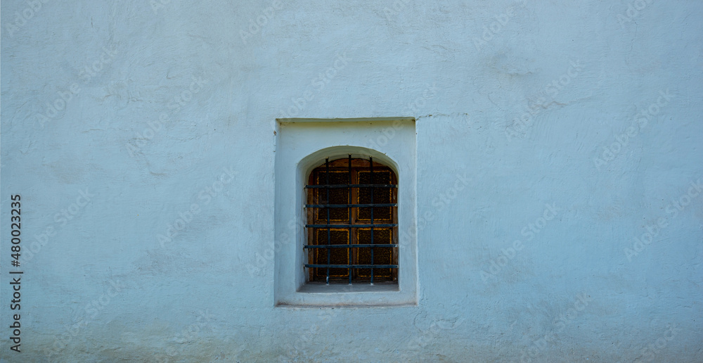 Background of castle wall. Old wall with window. Wall texture. Graphic texture element. Background of castle wall. Old wall with window. Wall texture. Graphic texture element.