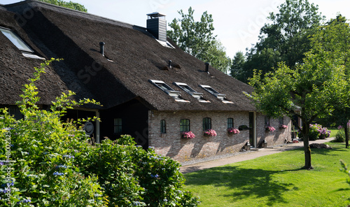 View of typical houses of Giethoorn, Netherlands. The beautiful houses and gardening city is know as "Venice of the North".