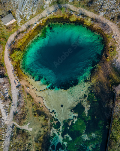 Landmark croatia: famous pond, blue hole Izvor Cetine, Dalmatia.