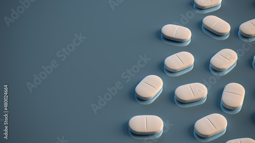 White pills on a plain reflecting surface. Copyspace available photo