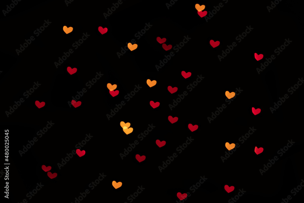 Bokeh red and yellow lights isolated on black background. Heart-shaped, love concept, Valentine's Day, February 14 Bokeh red and yellow lights isolated on black background. Heart-shaped, love concept, Valentine's Day, February 14