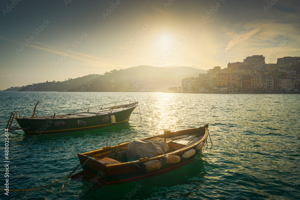 Wooden small boats in Porto Santo Stefano at sunrise. Argentario, Tuscany, Italy