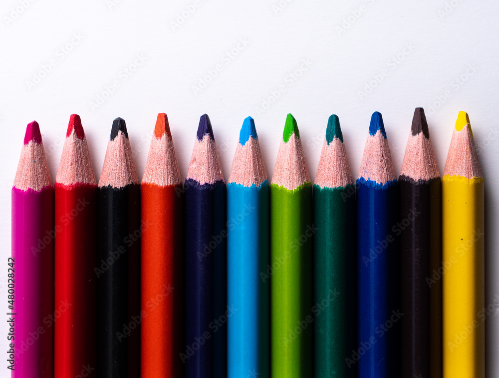 colored pencils placed evenly, thought alignment concept colored pencils placed evenly, thought alignment concept