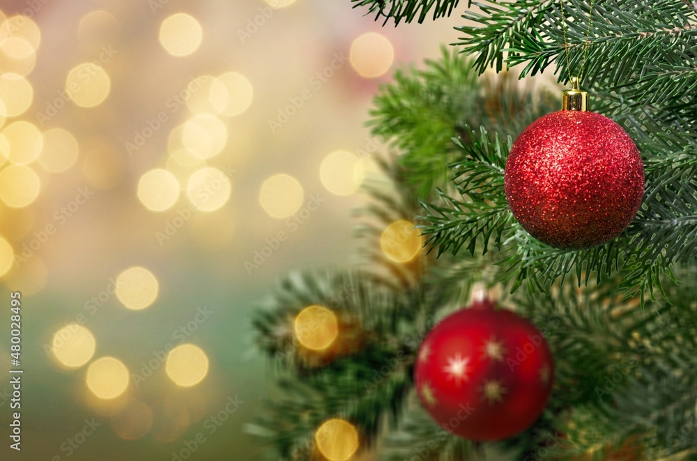 Christmas ball on the Christmas tree surrounded by festive lights. Christmas ball on the Christmas tree surrounded by festive lights.