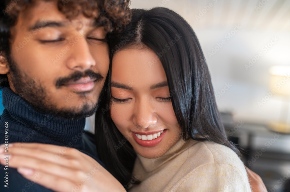 Close up face of man and woman with closed eyes Close up face of man and woman with closed eyes