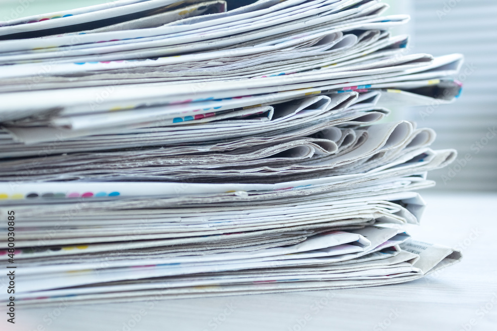 A stack of newspapers. Business news, finance. Latest information. Copy space A stack of newspapers. Business news, finance. Latest information. Copy space
