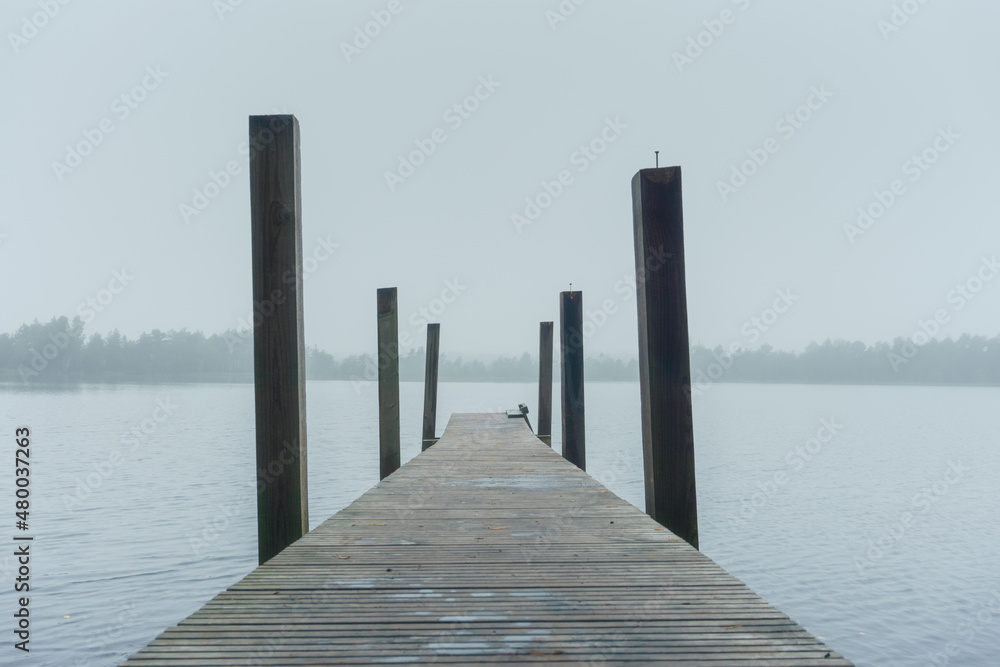 Lake with a pier in the early morning Lake with a pier in the early morning
