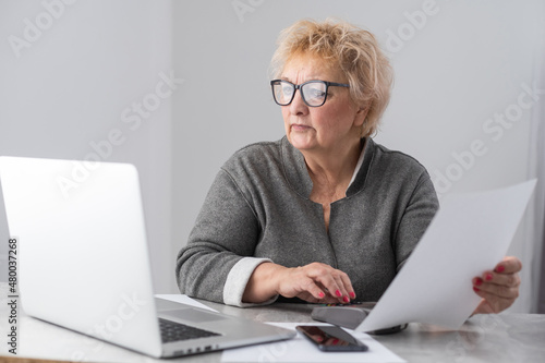 Pensioner read countless papers and is very focused photo