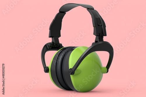 Protective green earphones muffs isolated on pink background