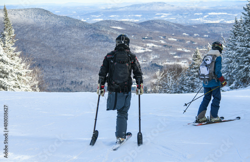 Adaptive Skiing with one leg : Disabled ski racer a three-tracker, or one-legged skier training kids how to ski at Stowe mountain resort