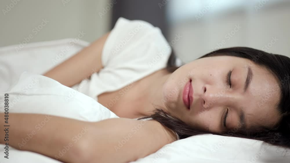 Beautiful woman can't fall asleep, moving restless on bed. Young woman having bad dream, sleep troubles trying can not sleep. Beautiful woman can't fall asleep, moving restless on bed. Young woman having bad dream, sleep troubles trying can not sleep.