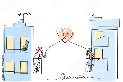 Man and Woman standing on balcony and drinking tea or coffee.