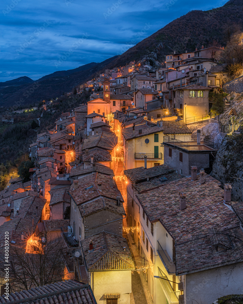 Panoramic night view of Paganico Sabino, beautiful village on Lake Turano, in the Province of Rieti, Lazio, Italy.