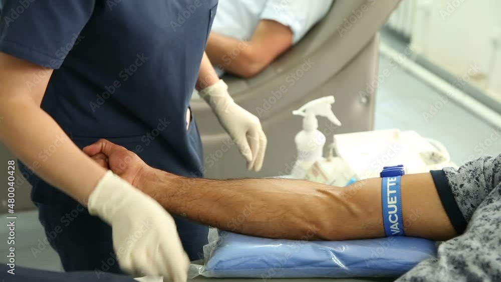 Take blood from volunteers at donor center. The nurse puts a tourniquet on arm, pricks needle into patients arm. Transfusion Machine Collects Blood Plasma Take blood from volunteers at donor center. The nurse puts a tourniquet on arm, pricks needle into patients arm. Transfusion Machine Collects Blood Plasma