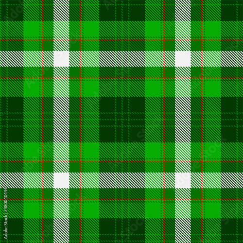Scottish tartan pattern in green, white and red cage. Seamless fabric texture. Traditional Scottish checkered background. Vector illustration.