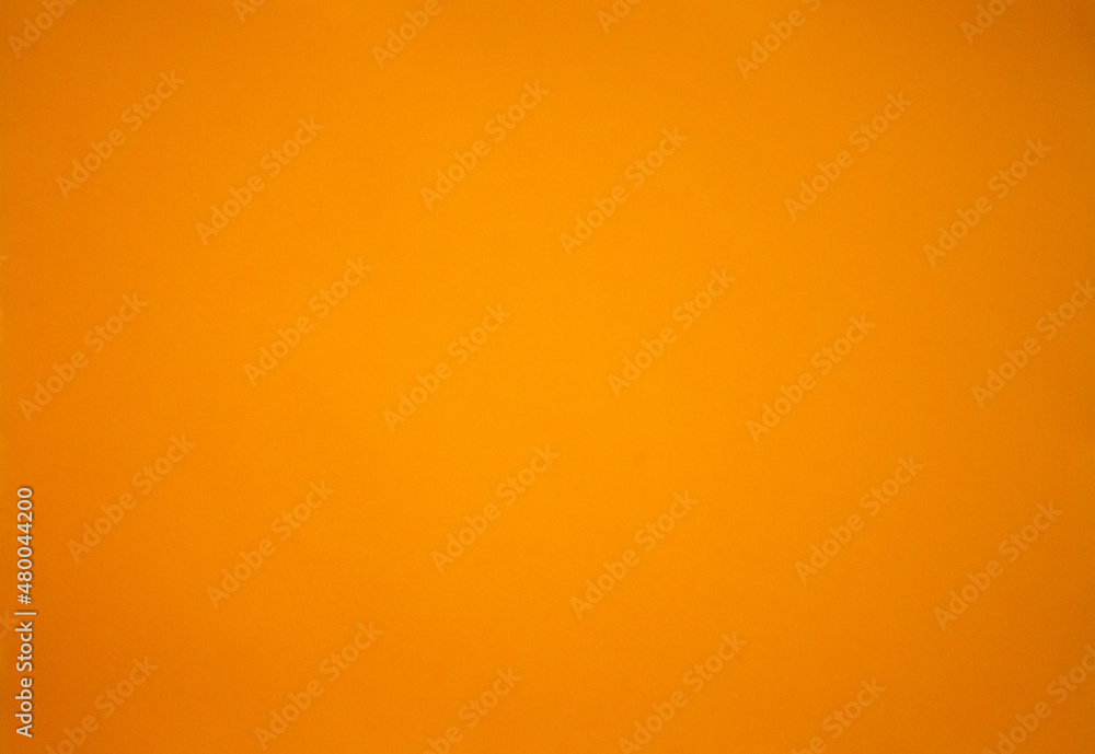 Photo of an orange-colored texture.Red clean background for the text.