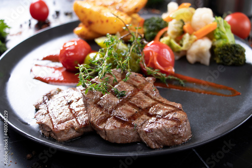 presentation with grilled beef and vegetables