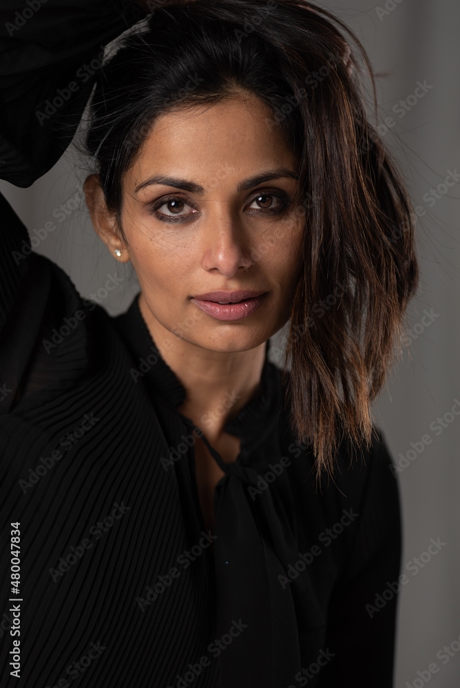 Studio headshots of beautiful Asian Indian woman in black blouse. Studio headshots of beautiful Asian Indian woman in black blouse.