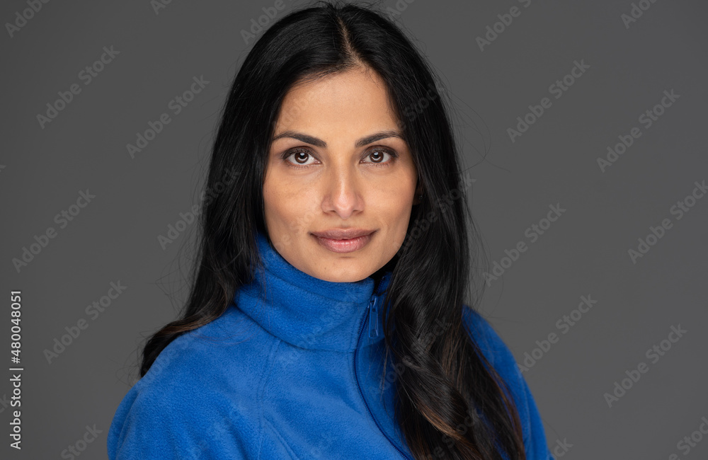 Studio headshot of beautiful Asian Indian woman on a plain background. Studio headshot of beautiful Asian Indian woman on a plain background.