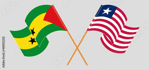 Crossed and waving flags of Sao Tome and Principe and Liberia