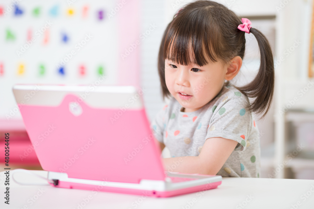 young girl using laptop for online learning during lockdown time young girl using laptop for online learning during lockdown time