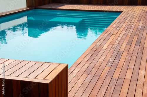 Canvas Print Hardwood ipe pool deck on direct sun heat, summer swimming pool decking design idea