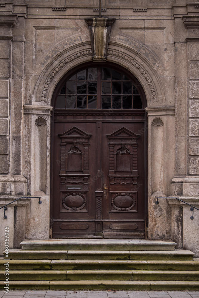 Munich, Germany - December 20 2021: Old Decorative Main Entrance Wooden Door.