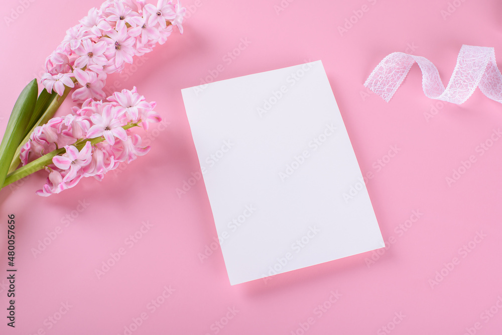 Blank wedding invitation stationery card mockup on pink background with hyacinth flowers and white ribbon, feminine blog flat lay, top view. Minimalist mockup 5x7 ratio, similar to A6, A5 Blank wedding invitation stationery card mockup on pink background with hyacinth flowers and white ribbon, feminine blog flat lay, top view. Minimalist mockup 5x7 ratio, similar to A6, A5