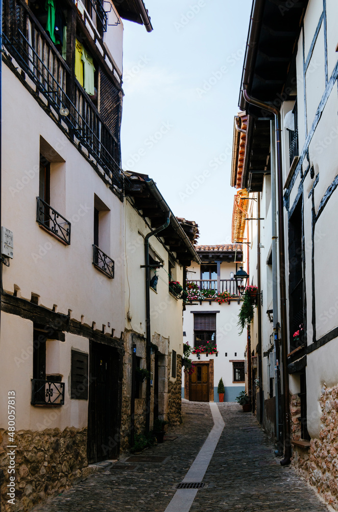 Street in covarrubias with its typical white adobe and half-timbered houses, Burgos, Castilla y León, Spain.