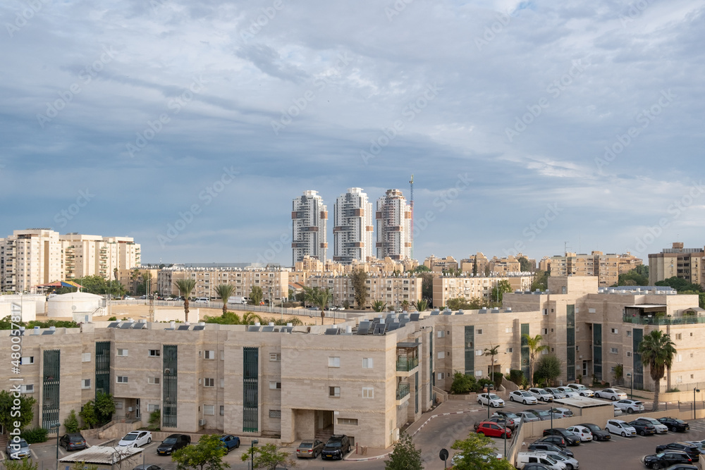 Contrast Architecture in Israel, modern tower skyscrapers and old buildings in Beer Sheba Neighbourhood. Old and new development architecture concept