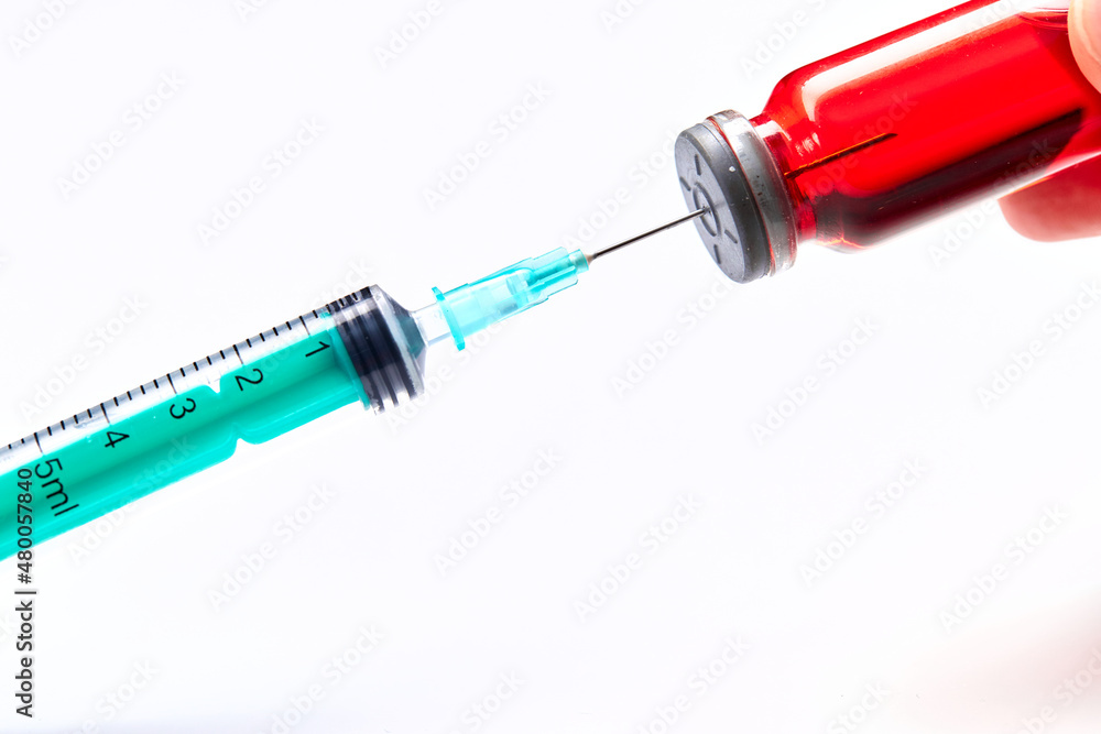 Vaccine in vial with syringe Vaccine in vial with syringe