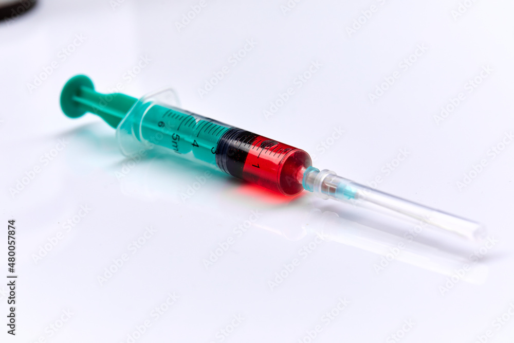 Vaccine in vial with syringe Vaccine in vial with syringe