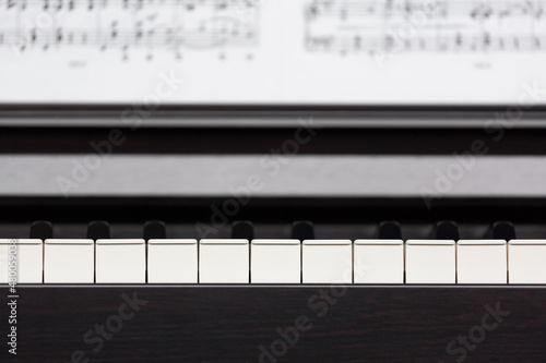 Photography Piano keyboard and sheet music blured