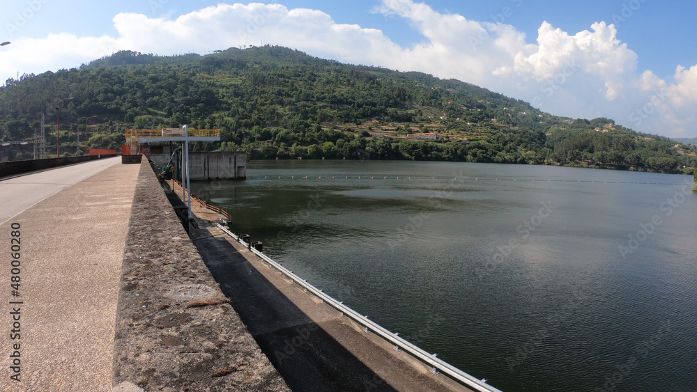 Sao Cristovao de Nogueira, Cinfaes, Portugal, June 11, 2021: The Barragem do Carapatelo (Carapatelo Dam) is situated in river Douro, on the border of the districts of Porto and Viseu in Portugal.