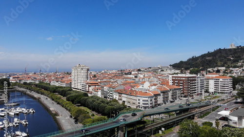 Viana do Castelo, Portugal, June 10, 2021: The Gustave Eiffel Bridge over the river Lima in Viana do Castelo. Aerial panoramic cityscape view of Viana and the Marina.