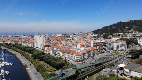 Viana do Castelo, Portugal, June 10, 2021: The Gustave Eiffel Bridge over the river Lima in Viana do Castelo. Aerial panoramic cityscape view of Viana and the Marina. photo