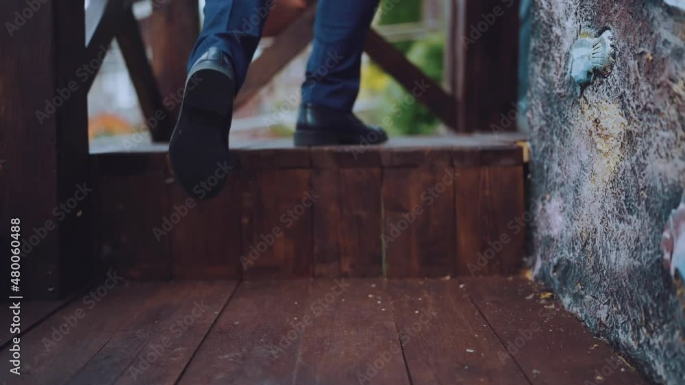 Footsteps in men's boots on wood Footsteps in men's boots on wood